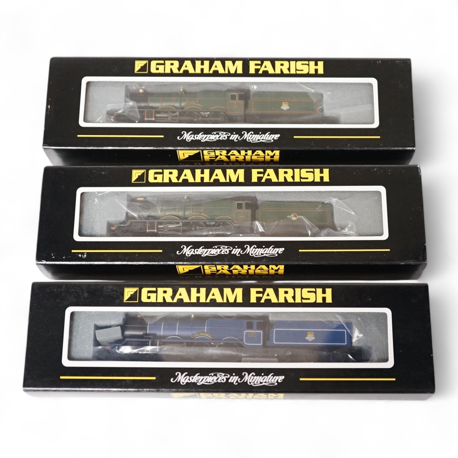 Three boxed Graham Farish N gauge railway BR locomotives; two Castle Class, 7033 Hartlebury Castle (372025) and 4080 Powderham Castle (372026), and a King Class 6021 King Richard II (372550). Condition - good.